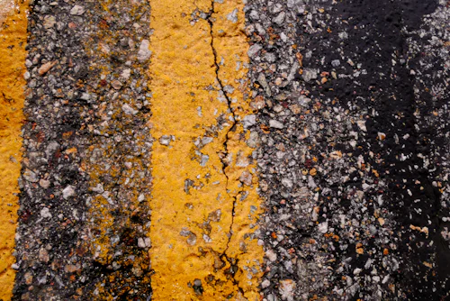 Cracked Road Pavement photo courtesy Unsplash